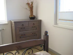 Visiting Deni's Home – two-level lime kitchen with painted details and a cleaner modern living room, photo 7