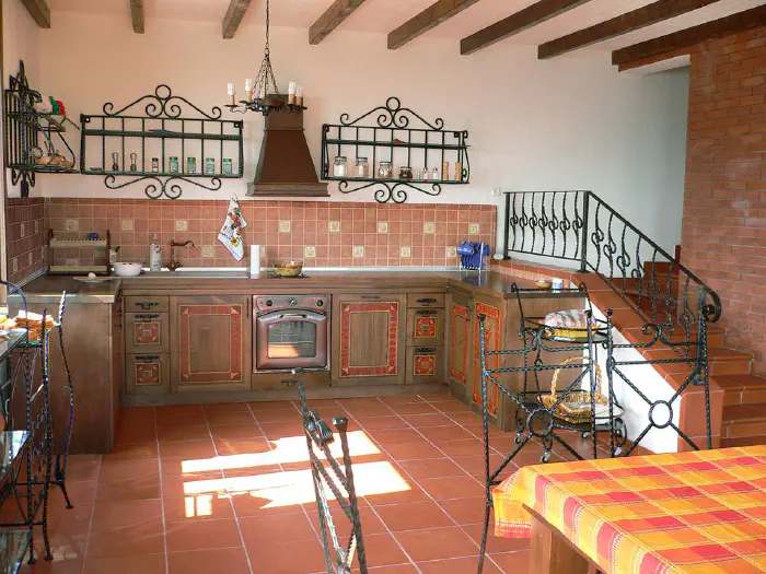 Kitchen Albena – wrought iron shelves instead of wall units, openwork painting on the doors, pull-out baskets, photo 1